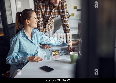 Two designers working at a new technical drawing Stock Photo
