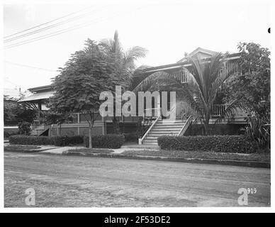 Manila, Philippines. View of a private house with terrace and palm trees on a street Stock Photo