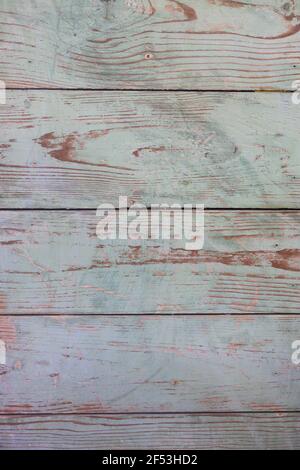 Old antique rustic and distressed wooden boards in light blue with rusty nails at the edge and lots of grain for vertical background or wallpaper Stock Photo