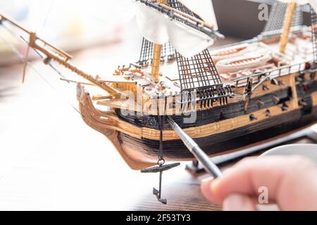Model Ship Building handcraft on table with different materials. Stock Photo