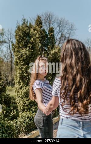 Youth culture, freedom youth teenager, gen z, millennial generation lifestyle. Happy teen girl having fun at park in sunny day. Stock Photo
