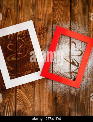 photo frames with heart  and coffee silhouette from coffee and powdered sugar on wooden background Stock Photo