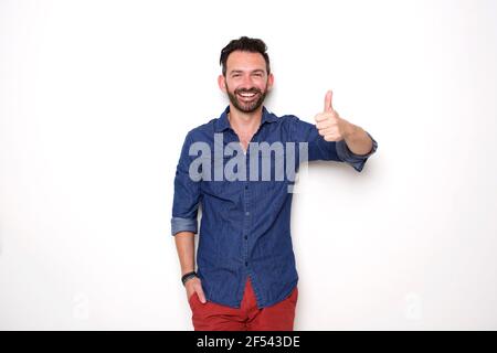 Portrait of confident mature man showing thumbs up over white background Stock Photo