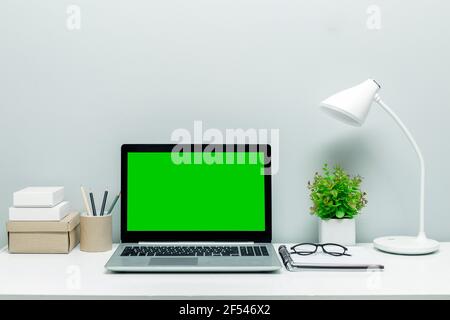 Mockup design laptop monitor screen with green screen. Desktop. Copy space. Stock Photo