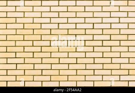 Abstract of a light yellow brick wall background Stock Photo