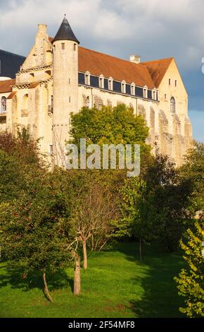 View of ancient Saint Severin abbey building (nowadays nursing home) surrounded by apples tree garden. Chateau-Landon, France. Autumn travel in French Stock Photo