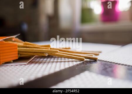 a long crispy straws on the kitchen table Stock Photo