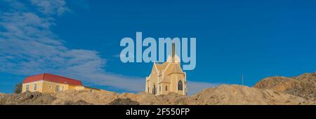 Beautiful panoramic view of the protestant german colonial church Felsenkirche in Luederitz, Luderitz in Namibia, Africa. Stock Photo