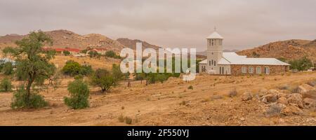 White Church from Town Aus, Namibia, background cloudy sky, Namib Naukluft Rand Stock Photo