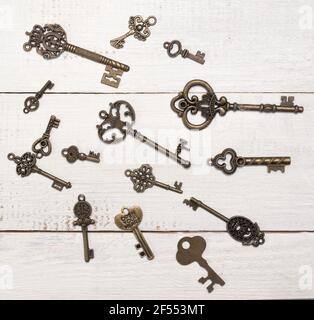 Old keys on a wooden background Stock Photo