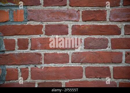 Red grunge brick wall, abstract background texture with old dirty and vintage style pattern. closeup macro photography Stock Photo