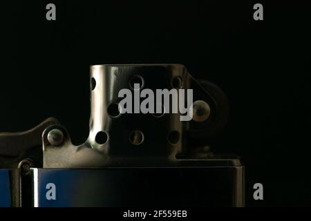 Zippo lighter close-up on black background, macro Stock Photo