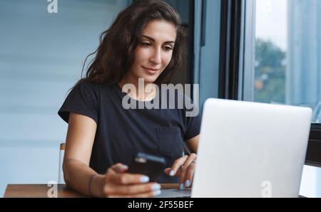 Self-quarantine, personal growth and development concept. Smiling woman working with computer remote home, employee get ready for online video-call Stock Photo