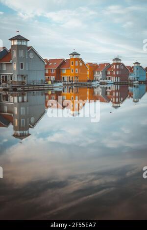 Colourful houses of Reitdiephaven in Groningen, the Netherlands. Amazing reflections in the water.