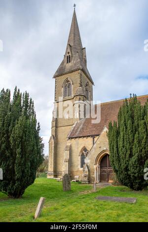 Warter, East Yorkshire, England, 23 March 2021 - St James Church and grave stones in an overgrown  church yard. Stock Photo