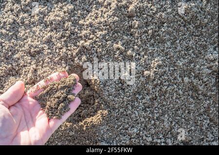 Control of fine-grained sand as a building material on a construction site Stock Photo
