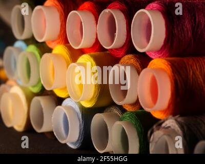 Sewing threads multicolored background closeup Stock Photo