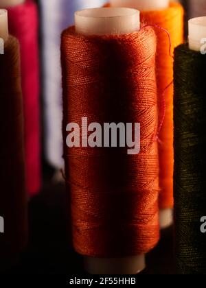 Sewing threads multicolored background closeup Stock Photo
