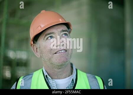 Portrait of male construction worker wearing hardhat Stock Photo