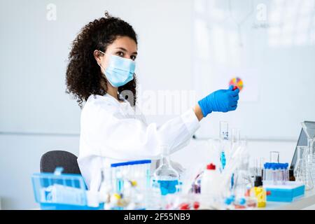 Female scientist experimenting in chemistry lab Stock Photo