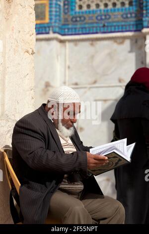 Israel,Jerusalem,Dome of the Rock,Muslim man reading the Koran Stock Photo