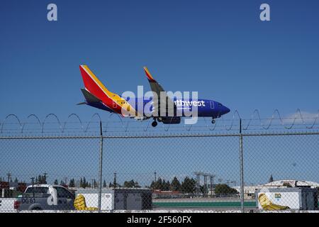 A Southwest Airlines Boeing 737-700 twin-jet airplane registration N47OWN lands at the Hollywood Burbank Airport, Tuesday, March 24, 2021, in Burbank, Stock Photo