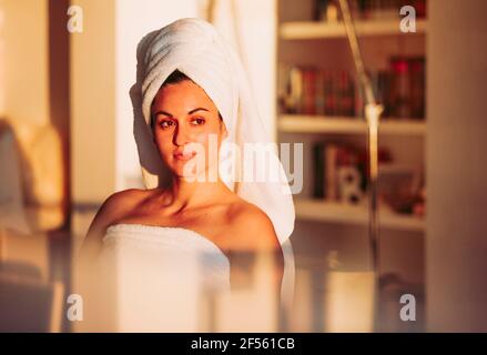 Relaxed woman with towel on her head at home Stock Photo
