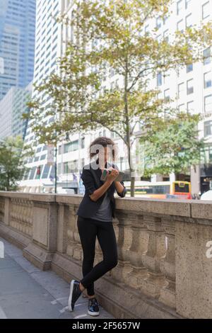 Young businesswoman writing in diary using digital tablet Stock Photo ...