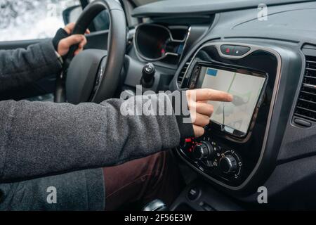 Man using navigational map while sitting in car Stock Photo