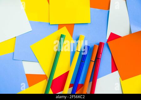 Overhead shot of a set of sketch markers on colorful blank note papers with space for your text Stock Photo