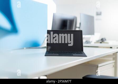 Digital tablet on desk at place of work Stock Photo