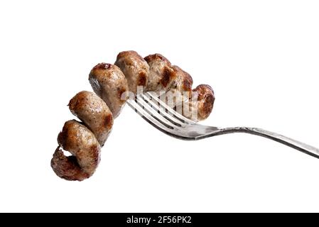 Grilled  spiral sausage on a fork isolated on white Stock Photo