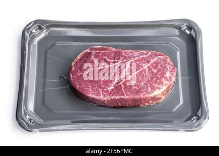 Raw beef  fillet steak in vacuum package isolated on white Stock Photo