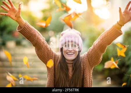 Carefree woman enjoying sunny autumn day Stock Photo