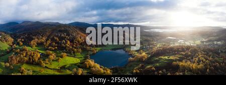 Aerial Panorama of Loughrigg Tarn and Elterwater in the Lake District Stock Photo