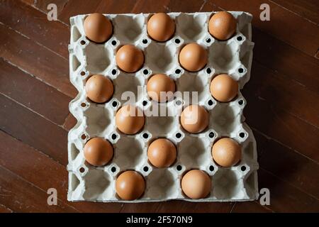 Eggs were placed in an egg carton in the chess pattern Stock Photo