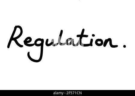 Regulation, handwritten on a white background. Stock Photo
