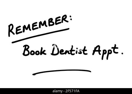 Remember - Book Dentist Appt, handwritten on a white background. Stock Photo