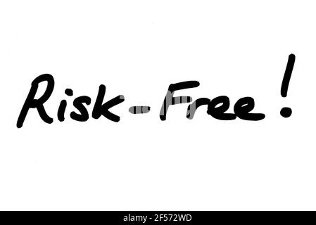 Risk-Free! handwritten on a white background. Stock Photo