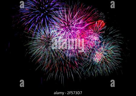 Fireworks in the dark night sky - black background Stock Photo