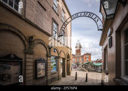 Chesterfield Town hall with clock and outdoor market place taken from The Shambles shops on summer day beautiful old medieval town with crooked spire. Stock Photo