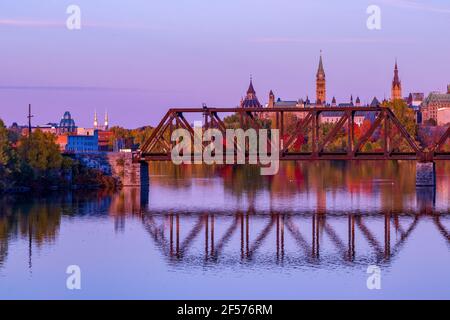 A purple sunset over downtown Ottawa and the Parliament Buildings of Canada Stock Photo