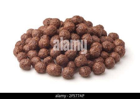 Pile of chocolate cereal balls isolated on white Stock Photo