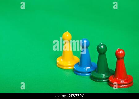 Many colorful game pieces, plastic figures Stock Photo