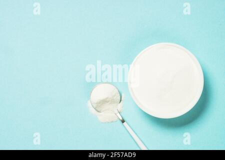 Collagen powder dietary supplement at blue Stock Photo - Alamy