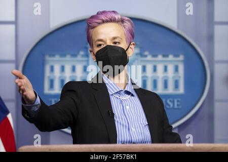 Washington, United States. 24th Mar, 2021. American professional soccer player Megan Rapinoe has her picture taken at the briefing room podium prior to the event to mark Equal Pay Day in the State Dining Room of the White House in Washington, DC, on March 24, 2021. Equal Pay Day marks the extra time it takes an average woman in the United States to earn the same pay that their male counterparts made the previous calendar year. Pool Photo by Michael Reynolds/UPI Credit: UPI/Alamy Live News Stock Photo