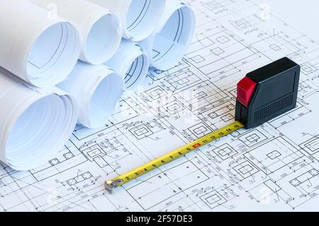 Blueprints and steel tape, drawings for foundation of a building construction Stock Photo