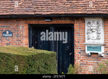 Wilbraham's Almshouses in Hadley Green, High Barnet, North London UK. Cottages are built of red brick and red roof tiles, have mullioned windows and p Stock Photo