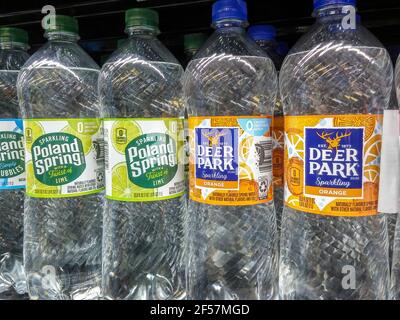 Bottles of Poland Spring and Deer Park brand water, formerly Nestlé products, in a supermarket in New York on Thursday, March 18, 2021. Nestlé SA has agreed to sell its spring water brands to private equity firms One Rock Capital Partners LLC and Metropoulos & Co. for $4.3 billion. (© Richard B. Levine) Stock Photo