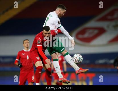 Serbia's Nemanja Radonjic (left) and Republic of Ireland's Matt Doherty battle for the ball during the 2022 FIFA World Cup Qualifying match at the Rajko Mitic Stadium in Belgrade, Serbia. Picture date: Wednesday March 24, 2021. Stock Photo